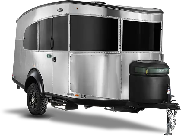 An Airstream Basecamp parked at a remote trailhead
