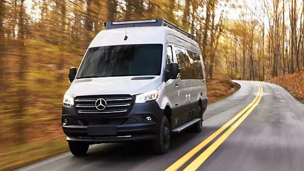 An Airstream Interstate touring coach on a coastal highway